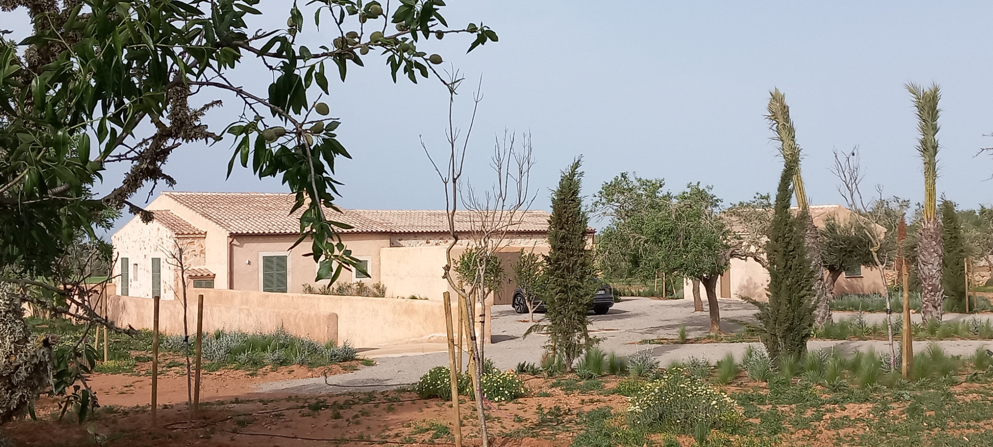 Main building and outbuilding with entrance area