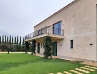 Rear view with balcony and garden